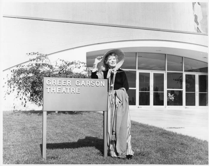 Greer Garson standing in front of the Greer Garson Theatre